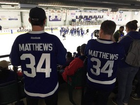 Maple Leafs fans watch the team practise in Paradise, N.L., on Friday. LANCE HORNBY/TORONTO SUN