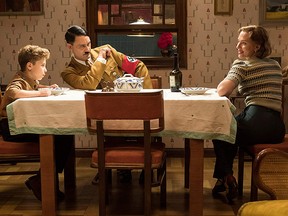 (L to R ) Roman Griffin Davis, Taika Waititi and Scarlett Johansson in "Jojo Rabbit."