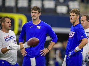 New York Giants quarterbacks Daniel Jones (left) and Eli Manning (right) warm up before the game against the Dallas Cowboys at AT&T Stadium. (Jerome Miron-USA TODAY Sports)