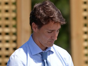 Prime Minister Justin Trudeau waits to be introduced before speaking about a watchdog's report that he breached ethics rules by trying to influence a corporate legal case regarding SNC-Lavalin, in Niagara-on-the-Lake, Ont., Aug. 14, 2019.
