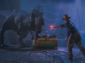 Dr. Alan Grant (Sam Niell) tries to distract a hungry T. Rex in Steven Spielberg's "Jurassic Park in 3D".