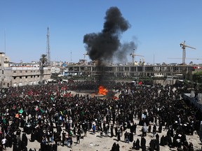 Iraqi Shi'ite Muslims burn a tent as they re-enact a scene from the battle of Kerbala during a ceremony marking Ashura in the holy city of Kerbala, Iraq, September 10, 2019. (REUTERS/Abdullah Dhiaa Al-Deen)