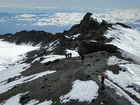 Climbers approach the summit of Mount Kilimanjaro.
