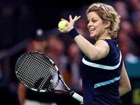 Belgium's Kim Clijsters waves to supporters during an exhibition match against Venus Williams in Antwerp to mark Clijsters' retirement, December 12, 2012. (REUTERS/Francois Lenoir/File Photo)