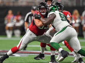 Atlanta Falcons offensive guard Chris Lindstrom (63) blocks against New York Jets defensive tackle Foley Fatukasi (94) during the first half at Mercedes-Benz Stadium on Aug. 15, 2019.