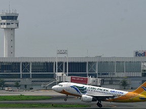 A Cebu Pacific plane takes off at the Ninoy Aquino International Airport in Manila on October 26, 2010. (NOEL CELIS/AFP/Getty Images)