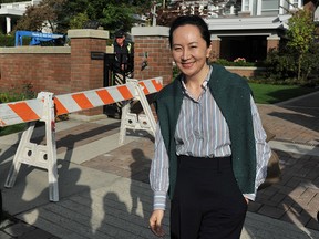 Huawei chief financial officer Meng Wanzhou, leaves her Vancouver home to appear in British Columbia Supreme Court, in Vancouver, on Sept. 25, 2019.
