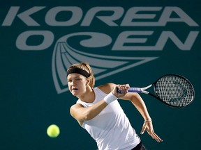 Karolina Muchova of the Czech Republic returns a shot to Magda Linette of Poland during their final match of the Korea Open tennis championships in Seoul, South Korea, Sunday, Sept. 22, 2019.