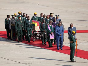 The body of former Zimbabwean President Robert Mugabe arrives at Harare, Zimbabwe September 11, 2019. (REUTERS/Siphiwe Sibeko)