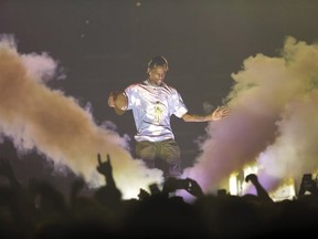 Rapper Travis Scott performs onstage at Capital One Arena on Tuesday, March 12, 2019, in Washington. A judge has nixed a proposed class action lawsuit over rapper Travis Scott's tardy appearance at the Osheaga festival in 2018.