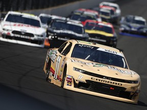 Justin Haley, driver of the #11 LeafFilter Chevrolet, leads a pack of cars during the NASCAR Xfinity Series Indiana 250 at Indianapolis Motor Speedway on September 7, 2019 in Indianapolis. (Brian Lawdermilk/Getty Images)