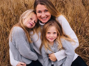 Sarah Cotton holds her daughters Chloe, left, and Aubrey Berry in October 2017 in this handout photo. (THE CANADIAN PRESS/HO, Ryan MacDonald Photography)