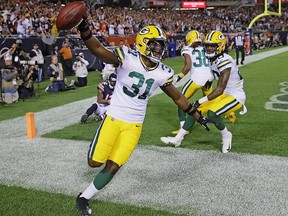 Adrian Amos of the Green Bay Packers celebrates after intercepting a pass in the end zone at Soldier Field on September 5, 2019 in Chicago.