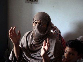 Mother of eight-year-old Muhammad Faizan, who according to police was missing and his body found along with two other children, reacts as she speaks with Reuters at her home in Chunian, Kasur, Pakistan, September 19, 2019.