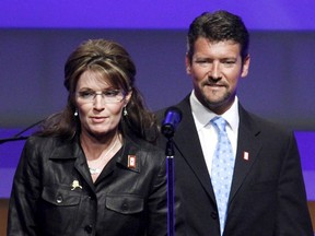 In this June 8, 2009, file photo, Republican Alaska Gov. Sarah Palin and her husband Todd Palin arrive at a Republican congressional fundraiser in Washington.  Court documents appear to show that the husband of former Alaska governor and 2008 Republican vice presidential nominee Sarah Palin is seeking a divorce. The papers, which provide only initials, were filed Friday by T.M.P. against S.L.P. Todd Palin's middle name is Mitchell and Sarah Palin's middle name is Louise. The documents say the couple married Aug. 29, 1988 -- the same as the Palins. Birthdates for the two also correspond.