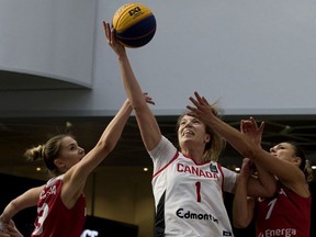 Team Canada's Michelle Plouffe battles Team Poland's Klaudia Sosnowska and Agnieszka Szott-Hejmej during the FIBA 3x3 Women's Basketball Series at West Edmonton Mall, in Edmonton Saturday Sept. 21, 2019. Team Canada won 22-10.