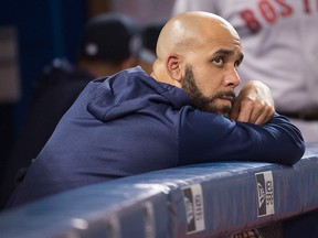Boston Red Sox starting pitcher David Price looks out from the dugout during the seventh inning against the Toronto Blue Jays at Rogers Centre.
