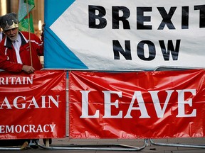 People protest outside as the Supreme Court of the United Kingdom holds the hearing on Prime Minister Boris Johnson's decision to prorogue parliament, in London, September 17, 2019. (REUTERS/Phil Noble)