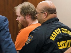 Accused mass shooter Ronald Lee Haskell is escorted by deputies for a hearing in Houston on July 11, 2014.