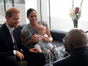 Britain's Prince Harry and his wife Meghan, Duchess of Sussex, holding their son Archie, meet Archbishop Desmond Tutu at the Desmond & Leah Tutu Legacy Foundation in Cape Town, South Africa, Wednesday, Sept. 25, 2019.