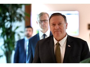 U.S. Secretary of State Mike Pompeo and U.S. special representative on Iran Brian Hook arrive at al-Bateen Air Base in Abu Dhabi, United Arab Emirates September 19, 2019.