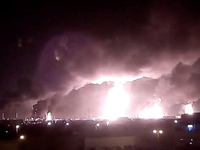 Fires burn in the distance after a drone strike on Saudi company Aramco's oil processing facilities, in Buqayq, Saudi Arabia September 14, 2019.