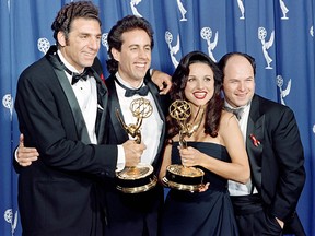 In this file photo taken on September 19, 1993 the cast of the Emmy-winning "Seinfeld" show (L-R) Michael Richards, Jerry Seinfeld, Julia Louis-Dreyfus and Jason Alexander pose with the Emmys they won for Outstanding Comedy Series on in Pasadena, California. (SCOTT FLYNN/AFP/Getty Images)