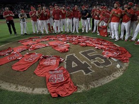 Los Angeles Angels players lay their jerseys on the pitcher’s mound after they won a combined no-hitter against the Seattle Mariners at Angel Stadium of Anaheim on July 12, 2019. (John McCoy/Getty Images)