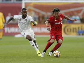 Toronto FC midfielder Tsubasa Endoh (31) controls the ball against Colorado Rapids defender Kellyn Acosta (10) during the first half at BMO Field on Sept. 15, 2019.