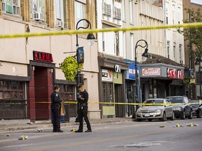 Niagara Regional Police Service officers investigate a shooting that took place early Sunday in the area of the Karma nightclub in St. Catharines, Ont., Sunday, September 29, 2019. (THE CANADIAN PRESS/Tara Walton)