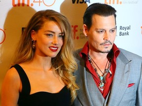 Johnny Depp with his wife Amber Heard on the red carpet for movie "Black Mass" during the Toronto International Film Festival in Toronto on Friday September 11, 2015.