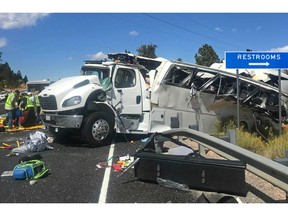 This photo released by the Garfield County Sheriff's Office shows a tour bus that was carrying Chinese-speaking tourists after it crashed near Bryce Canyon National Park in southern Utah, killing at least four people and critically injuring up to 15 others, Friday, Sept. 20, 2019.