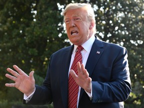 U.S. President Donald Trump talks with reporters on the South Lawn of the White House in Washington, Sunday, Sept. 22, 2019, as he prepares to board Marine One for the short trip to Andrews Air Force Base.