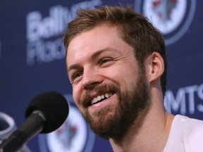 Josh Morrissey laughs while addressing media as the Winnipeg Jets cleaned out their lockers at Bell MTS Place in Winnipeg on Mon., April 22, 2019. Kevin King/Winnipeg Sun/Postmedia Network