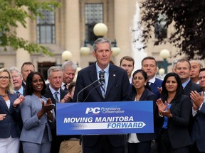 Premier Brian Pallister is applauded at a press conference behind the Manitoba Legislative Building after dropping the writ on Mon., Aug. 12, 2019. Kevin King/Winnipeg Sun/Postmedia Network