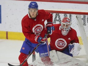 Nick Suzuki sets up for a tip in front of goalie Cayden Primeau during Montreal Canadiens rookie camp at the Bell Sports Complex in Brossard on Sept. 5, 2019.