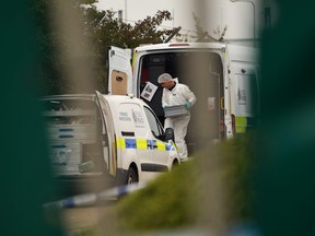 A police forensic investigation team are parked near the site where 39 bodies were discovered in the back of a truck on October 23, 2019 in Thurrock, England. (Photo by Leon Neal/Getty Images)