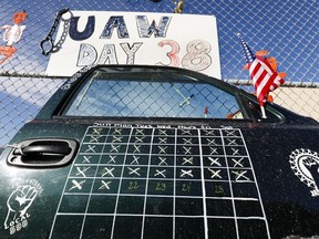 A truck door with a calendar on it that shows the number of days that the UAW-GM strike has lasted is shown at the General Motors Flint Assembly plant on October 23, 2019 in Flint, Michigan.