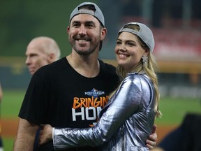 Justin Verlander of the Houston Astros and Kate Upton celebrate the 6-1 win over the Tampa Bay Rayst in game five of the American League Division Series at Minute Maid Park on October 10, 2019 in Houston, Texas.