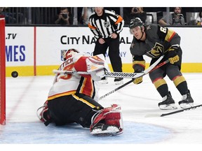 Flames goalie David Rittich steers aside a shot by Golden Knights sniper Jonathan Marchessault in the second period of their game at T-Mobile Arena on Saturday night in Las Vegas.