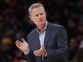 Head Coach Steve Kerr of the Golden State Warriors coaches from the bench during the first half of a game against the Los Angeles Lakers at Staples Center on October 16, 2019 in Los Angeles, California.