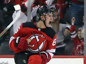 Jack Hughes of the New Jersey Devils celebrates his first NHL goal at the Prudential Center on October 19, 2019 in Newark, New Jersey.