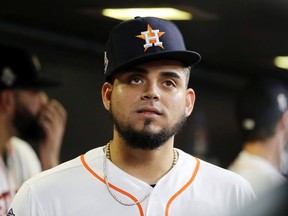 Roberto Osuna of the Houston Astros looks on from the dugout prior to Game One of the 2019 World Series against the Washington Nationals at Minute Maid Park on October 22, 2019 in Houston, Texas.