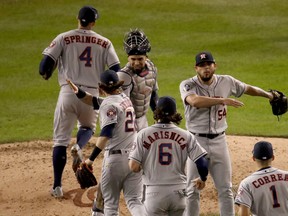 The Houston Astros celebrate their 4-1 win against the Washington Nationals in Game Three of the 2019 World Series at Nationals Park on October 25, 2019 in Washington, DC. (Photo by Win McNamee/Getty Images)