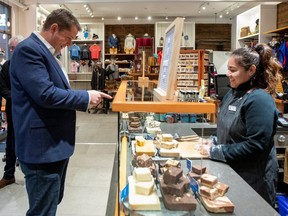 Conservative Leader Andrew Scheer is shown buying fudge while campaigning in Vancouver on Sunday. (Reuters)
