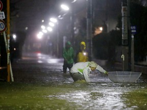 Roads are flooded due to heavy rains caused by Typhoon Hagibis at Setagaya ward in Tokyo, Oct. 12, 2019, in this photo taken by Kyodo. (Kyodo/via REUTERS)