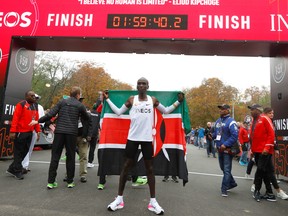 Kenya's Eliud Kipchoge, the marathon world record holder, celebrates after a successful attempt to run a marathon in under two hours in Vienna, Austria, Oct. 12, 2019. REUTERS/Leonhard Foeger