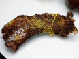 The "blob," slime mould (Physarum polycephalum), a single-celled organism forming over a piece of tree chunk, is pictured at the Paris Zoological Park during a press preview in Paris, Oct. 16, 2019. (REUTERS/Benoit Tessier)