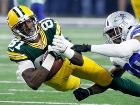 Brandon Carr #39 of the Dallas Cowboys tackles Geronimo Allison #81 of the Green Bay Packers in the first half during the NFC Divisional Playoff Game at AT&T Stadium on January 15, 2017 in Arlington, Texas.