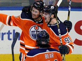 Edmonton Oilers Joakim Nygard celebrates his goal with team mates Gaetan Haas (right) and Ethan Bear (front) during third period NHL game action against the Los Angeles Kings in Edmonton on Saturday Oct. 5, 2019.